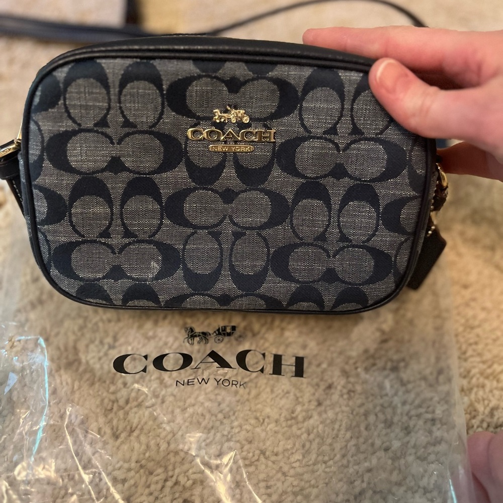 Coach denim mini handbag. Used a couple of times. Perfect condition.